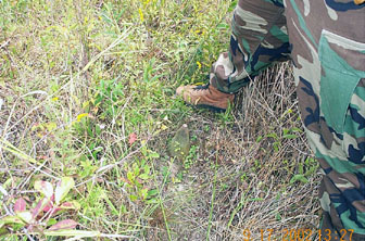 Figure 4.1.  EOD technician marking the position of a UXO.