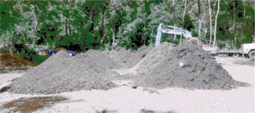 Compost treatment piles made with PCB contaminated soil.
