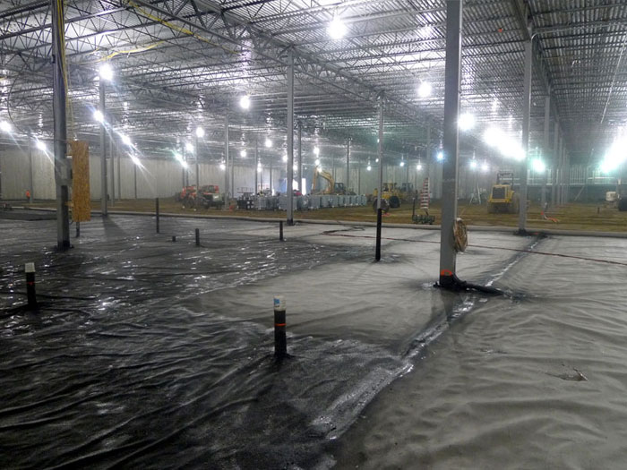 Figure 1. Installation of geomembrane (Liquid Boot®) as a vapor barrier.